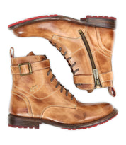 A pair of Bed|Stü Endure tan rugged leather lace-up ankle boots with side zippers, buckles, and red durable treaded outsoles, displayed side by side on a white background.