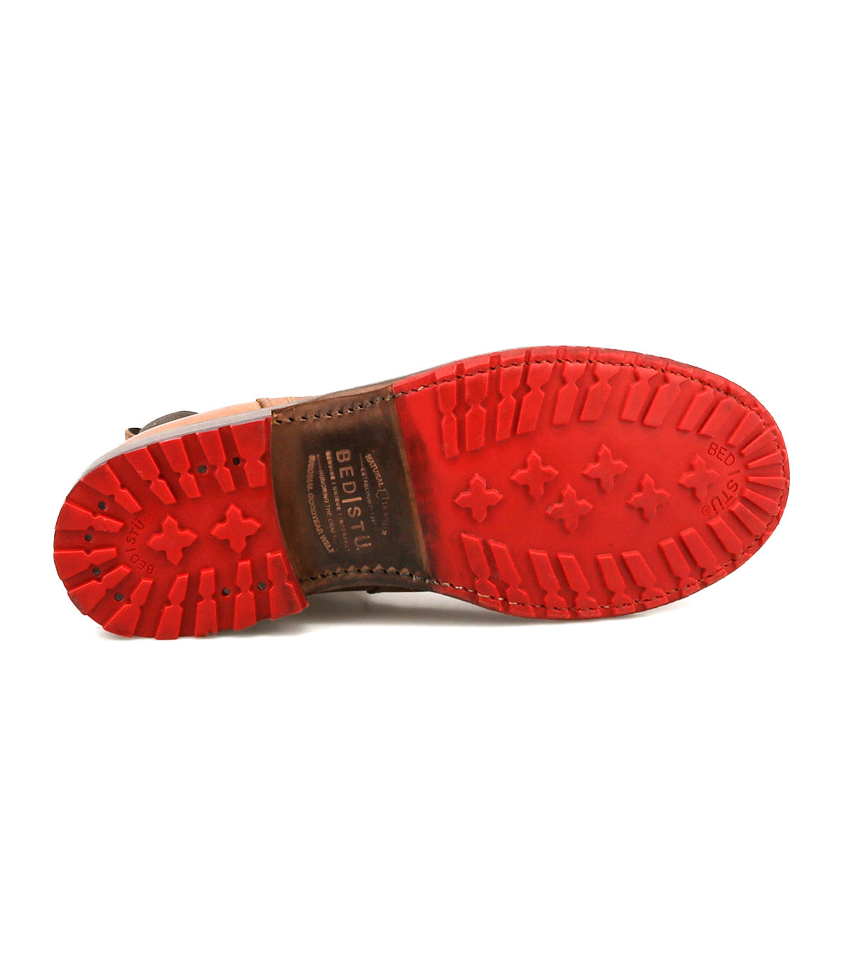 Bottom view of the Ethic Chelsea boot in brown, featuring a red, durable rubber sole with textured tread and the brand name “Bed|Stü” stamped in the center.