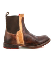 The Bed|Stü Ethic is a brown leather Chelsea boot featuring a beige side panel, black elastic gusset, red outsole accents, and a back pull tab—pictured here from the left side. Durable and fully leather-lined, the Ethic Chelsea boot seamlessly blends signature style with lasting comfort.