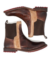 A pair of Bed|Stü Ethic durable brown leather Chelsea boots with beige accents, dark elastic side panels, red tread outsoles, and pull tabs, displayed side by side on a white background.