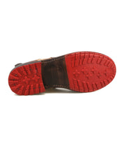 The Bed|Stü Ethic boot is shown from the bottom, highlighting its red rubber sole with a rugged tread pattern and visible edge stitching, expertly crafted for durability and lined with leather for comfort.