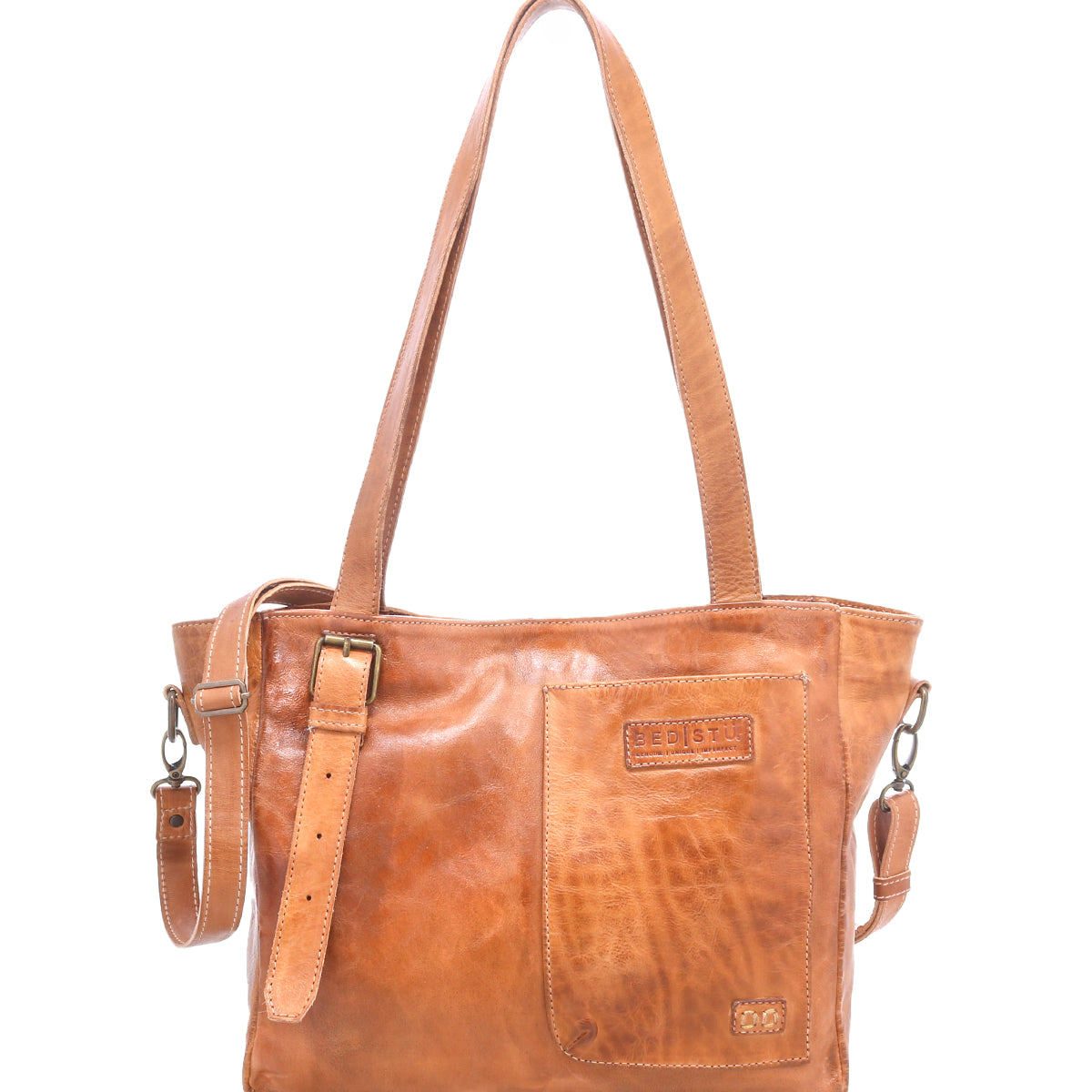 Light brown leather shoulder bag with a front patch pocket, detachable strap, and stitched detailing, the Bed|Stü Explicit LTC bag radiates rustic appeal and everyday dependability, displayed against a white background.