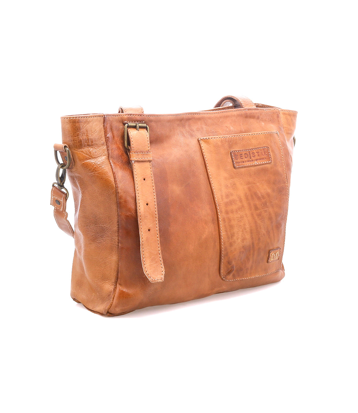 Bed|Stü Explicit LTC brown leather shoulder bag with adjustable strap, front pocket, and embossed logo, shown on a white background. Expertly crafted for everyday dependability, the Explicit LTC blends timeless design with rustic charm.