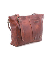 Bed|Stü Explicit LTC brown leather shoulder bag featuring a rectangular silhouette, front pocket, adjustable strap, and visible stitching. Finished with a branded patch on the front, this bag combines rustic charm with everyday dependability for lasting style.