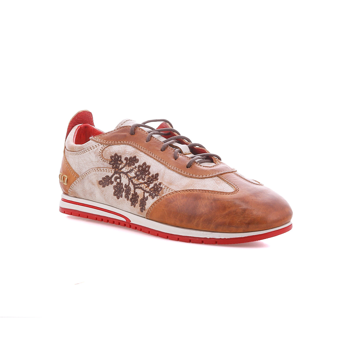 Introducing Extravagant by Bed|Stü: a brown leather sneaker adorned with floral embroidery, distinctive red accents, a crisp white midsole, and a bold red outsole. This lace-up silhouette is crafted for everyday wear and is displayed at an angle against a white background.