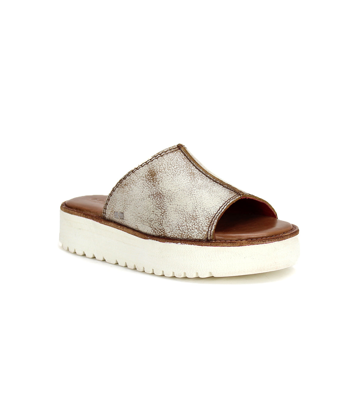The Bed|Stü Fairlee II is a metallic silver open-toe slip-on sandal featuring a thick white platform sole and cushioned footbed, displayed at an angle on a white background.