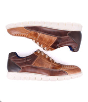 A pair of Bed|Stü Fairman men's brown three-tone leather sneakers with white, lightweight rubber soles, shown from the side and placed parallel against a white background.