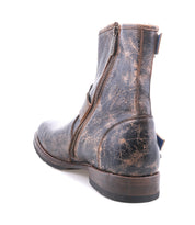 A rugged staple, the Bed|Stü Fellow distressed brown leather moto boot features a side zipper and visible creases, shown from a rear side angle on a white background.