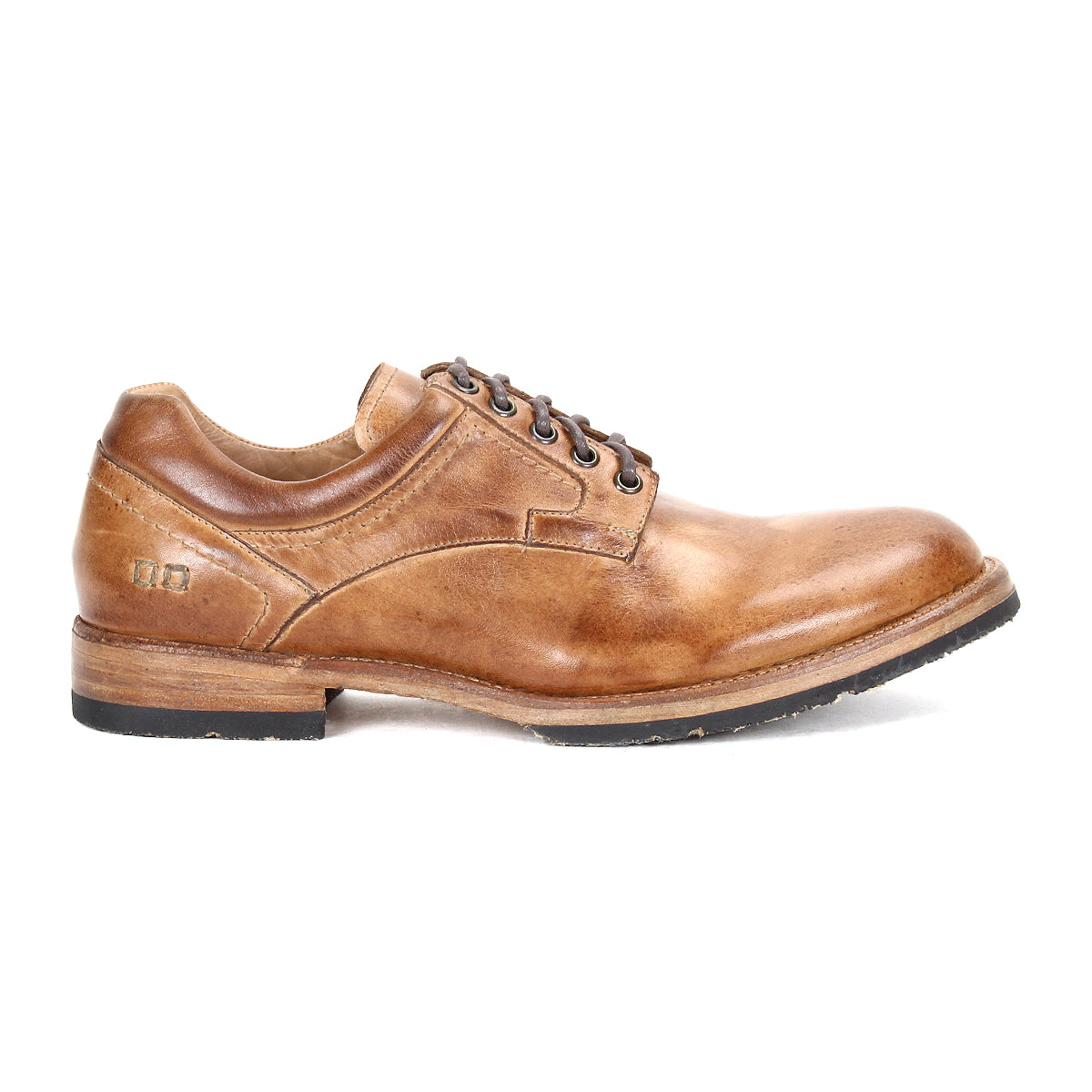The Bed|Stü Fierce is a brown washed leather derby lace-up dress shoe featuring a low heel, stitched detailing, and a black jute-infused outsole with Goodyear welt construction, shown in a left side profile against a white background.