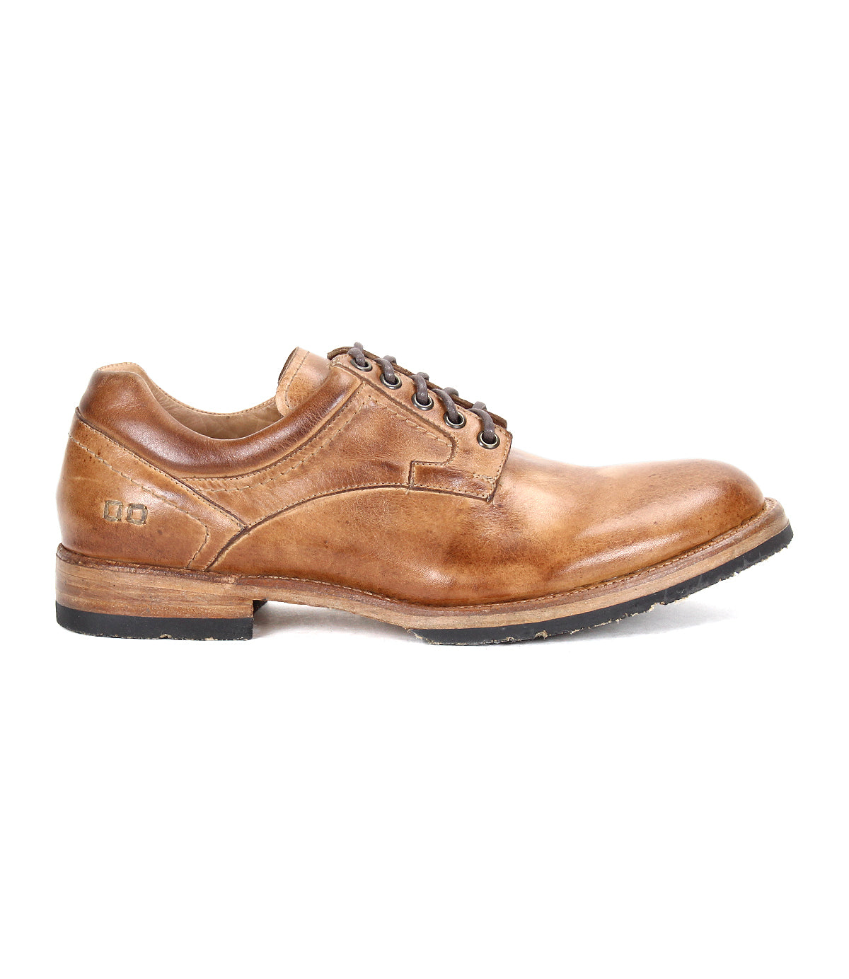 The Bed|Stü Fierce is a brown washed leather derby lace-up dress shoe featuring a low heel, stitched detailing, and a black jute-infused outsole with Goodyear welt construction, shown in a left side profile against a white background.