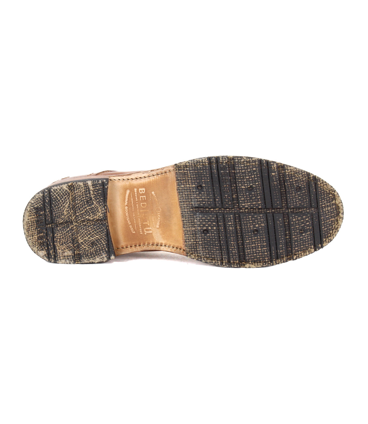 The image shows the bottom view of the Bed|Stü Fierce washed leather derby dress shoe, featuring a leather and textured rubber sole with visible tread patterns and a durable Goodyear welt.