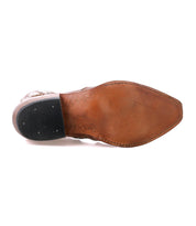 The image shows the bottom view of the Frio by Bed|Stü, a brown leather dress shoe with a pointed toe, featuring floral cutout detailing and a black rubber heel pad.