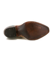 The sole of the Bed|Stü Frio features brown leather with visible branding and intricate stitching, viewed from the bottom; subtle Western bootie influence is evident in the design, accented by elegant antiqued brass studs.