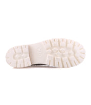 The image shows the white rubber sole of the Bed|Stü Fuel lightweight clog viewed from the bottom, displaying a patterned tread for grip.