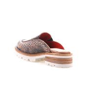 Back angled view of the Bed|Stü Fuel mule—a brown slip-on shoe featuring handwoven leather detailing, a red interior lining, chunky wooden heel, and an XL EXTRALIGHT outsole for a lightweight clog feel—shown against a white background.