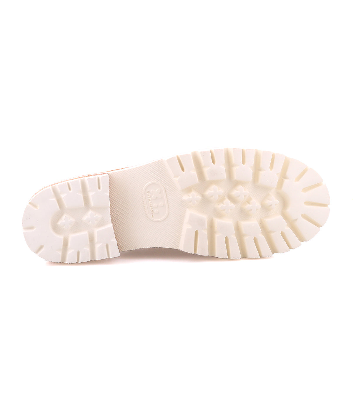 A bottom view of the Bed|Stü Fuel shoe showcases its white rubber sole with deep treads and textured patterns, featuring an XL EXTRALIGHT outsole for superior comfort, set against a plain white background.