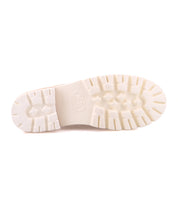 A bottom view of the Bed|Stü Fuel shoe showcases its white rubber sole with deep treads and textured patterns, featuring an XL EXTRALIGHT outsole for superior comfort, set against a plain white background.