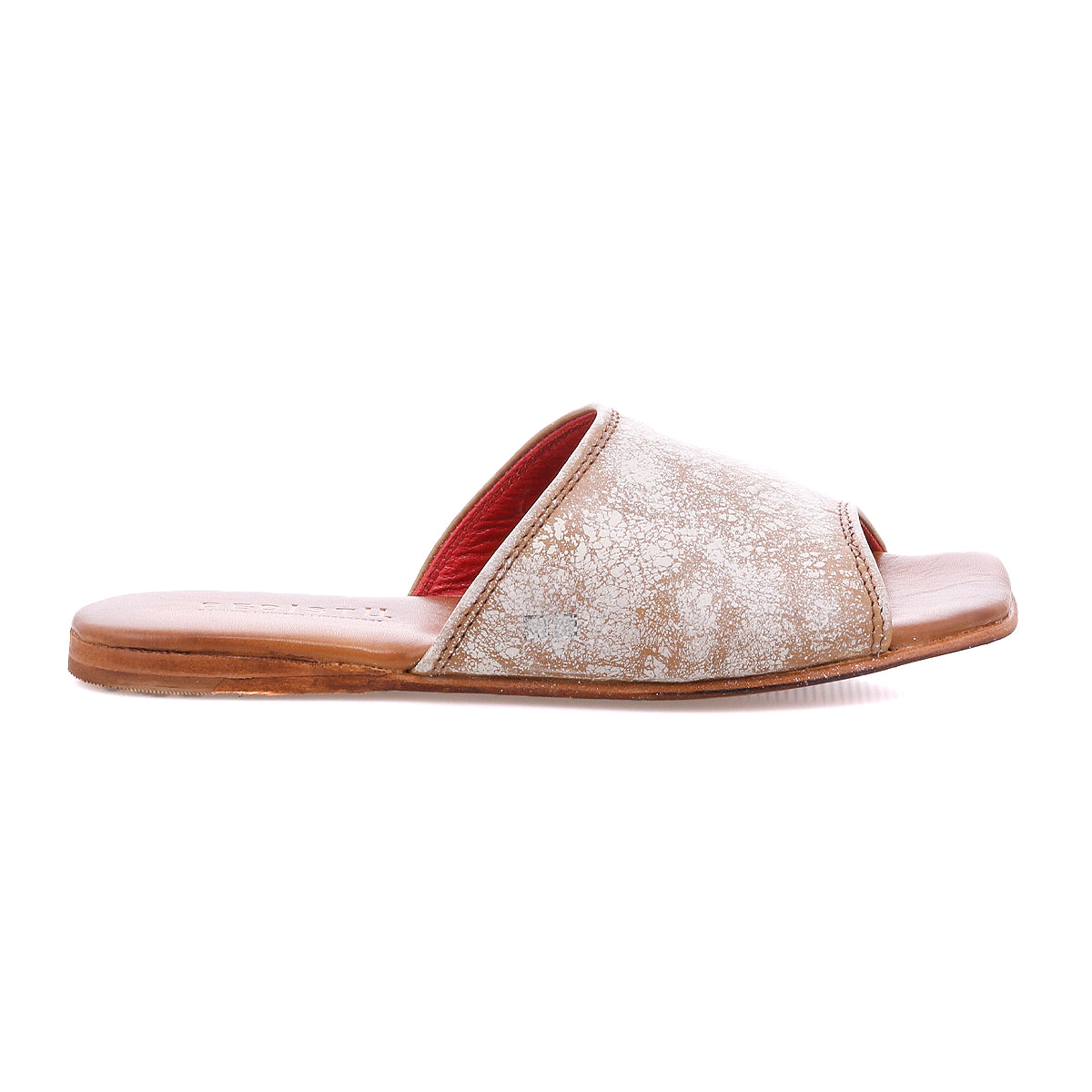 The Bed|Stü Gailee is a single brown open-toe leather slide sandal with a flat sole and textured upper, featuring a cushioned footbed for extra comfort, shown in a side view on a white background.