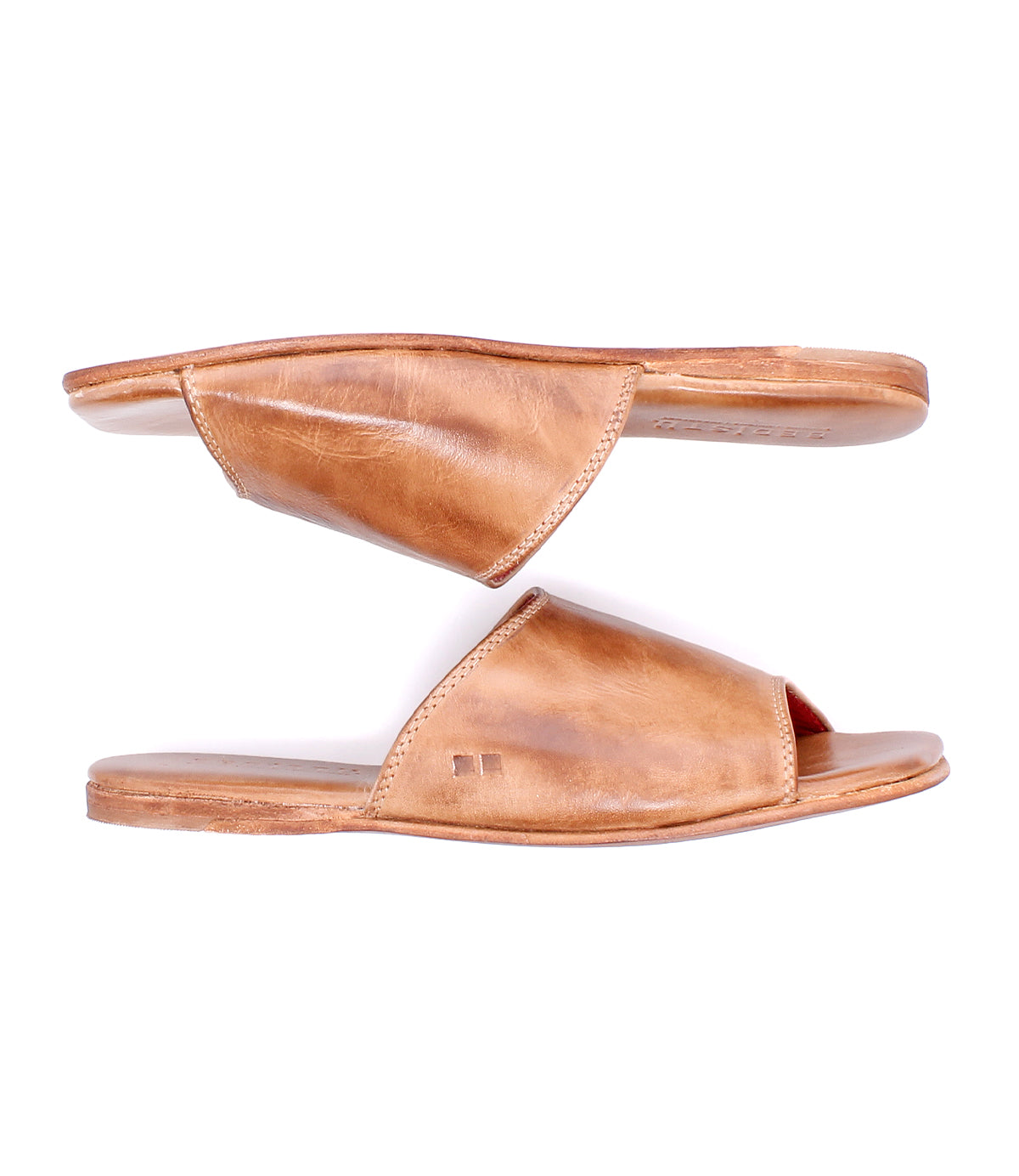 A pair of Bed|Stü Gailee brown leather slide open-toe sandals, displayed from the side with one sandal facing upward and the other facing downward. These sandals feature a cushioned footbed for added support and all-day comfort.