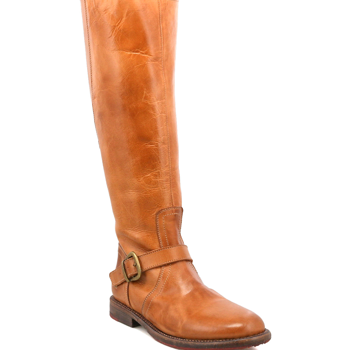 The Glaye by Bed|Stü is a single tall leather equestrian boot in tan, featuring a low heel and a vintage buckle at the side, standing upright against a white background.