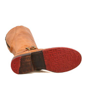 The Bed|Stü Glaye boot lies on its side, showcasing its textured red rubber sole with distinct tread patterns and a small vintage buckle accent on the side.
