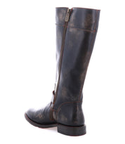 A single Bed|Stü Gogo Lug black leather mid-calf boot with a side zipper and lug outsole, shown from the rear against a white background.