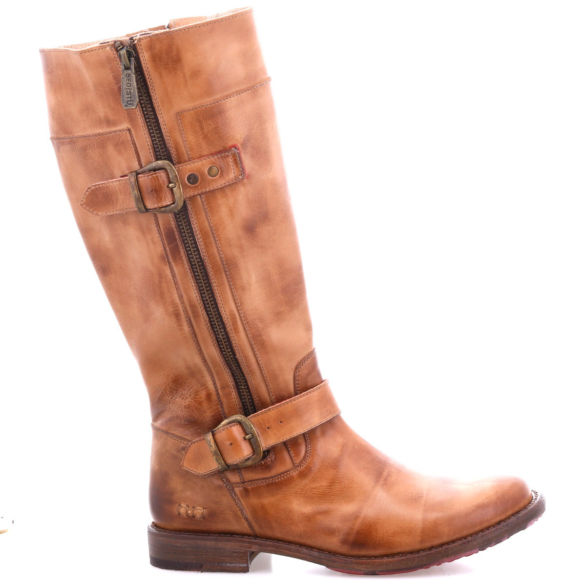 The Bed|Stü Gogo Lug is a brown leather knee-high engineer boot featuring a side zipper, two decorative buckles, and a low wooden heel, complete with a durable lug outsole; pictured in profile against a white background.