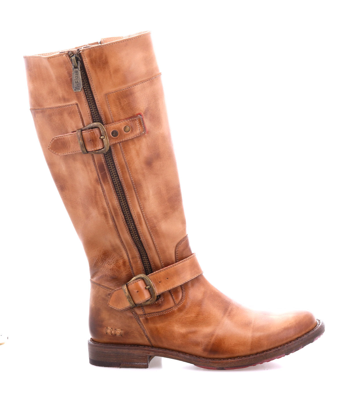 The Bed|Stü Gogo Lug is a brown leather knee-high engineer boot featuring a side zipper, two decorative buckles, and a low wooden heel, complete with a durable lug outsole; pictured in profile against a white background.