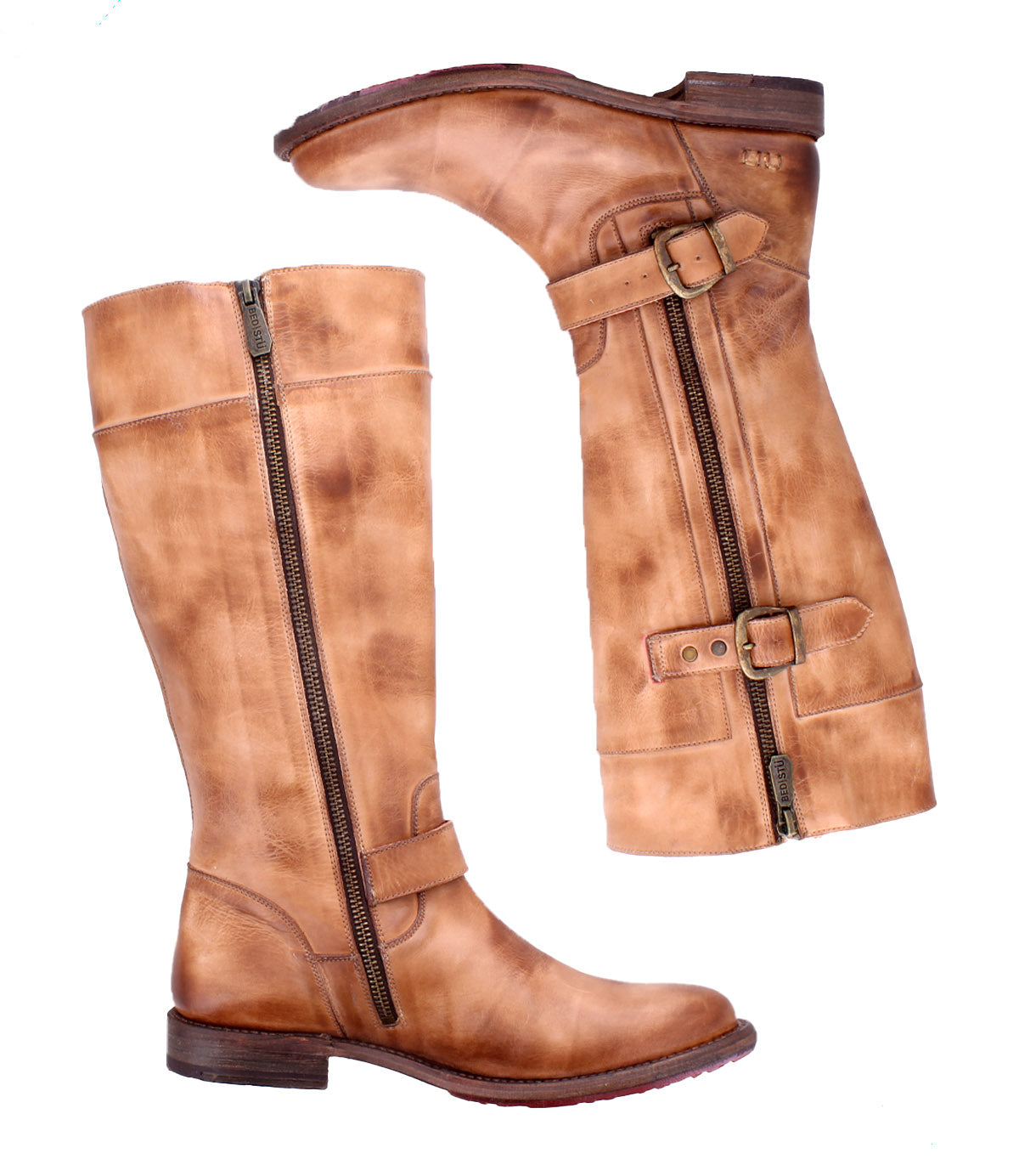 The Bed|Stü Gogo Lug boots are tan leather knee-highs featuring side zippers, decorative buckles, and a sturdy lug outsole, displayed from the side and front against a white background.