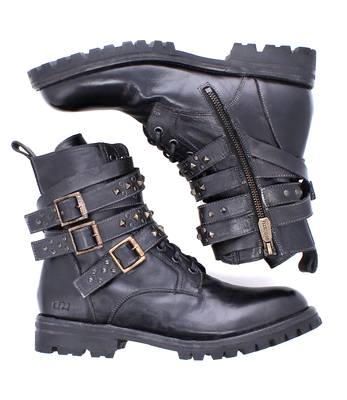 The Bed|Stü Grab boots are a pair of black leather combat boots featuring studded buckle straps, side zippers, and a durable Vibram sole, shown on a white background.