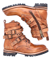 A pair of Bed|Stü Grab rugged brown leather combat boots with laces, studded buckle straps, and a side zipper, featuring sturdy studs and a durable Vibram sole, displayed against a white background.