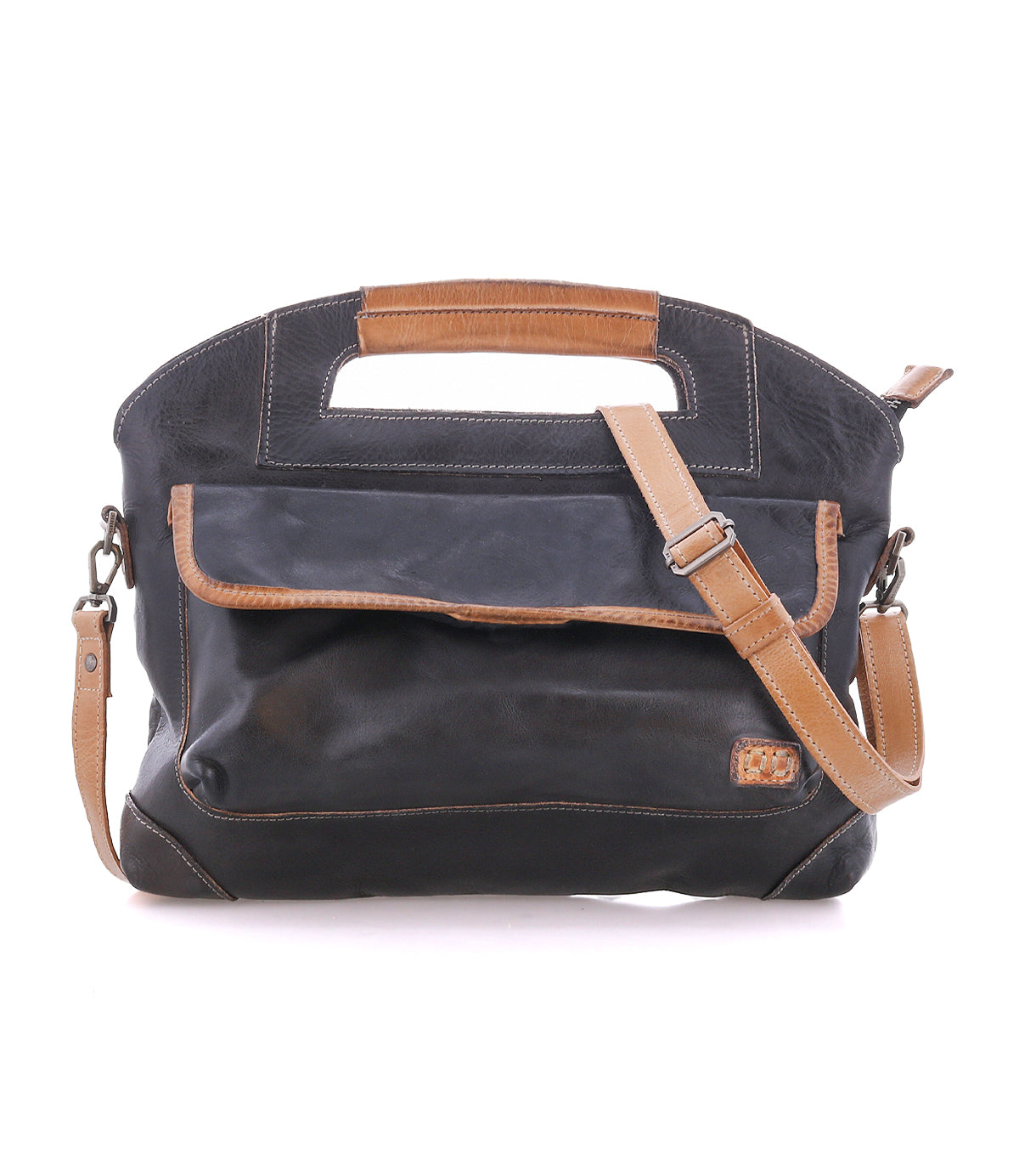 The Bed|Stü Greenway is a black and brown full-grain leather handbag featuring a front pocket, adjustable crossbody strap, built-in handle, and zip-top closure, displayed against a white background.