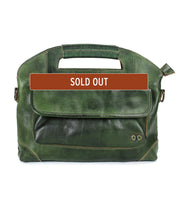 Bed|Stü Greenway messenger bag in dark green full-grain leather, featuring a front flap pocket, top handle, and adjustable crossbody strap. A brown "SOLD OUT" banner is displayed across the center of the bag.