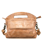 Introducing the Greenway by Bed|Stü: a tan leather handbag expertly crafted from luxurious full-grain leather, featuring a built-in handle, a front flap pocket, and an adjustable crossbody strap with metal clasps for versatile carrying options.