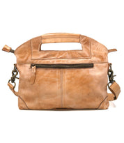 The Bed|Stü Greenway is a full-grain leather tan handbag with a cutout handle, front zipper pocket, and detachable crossbody strap. It features a zip-top closure and is displayed against a white background.