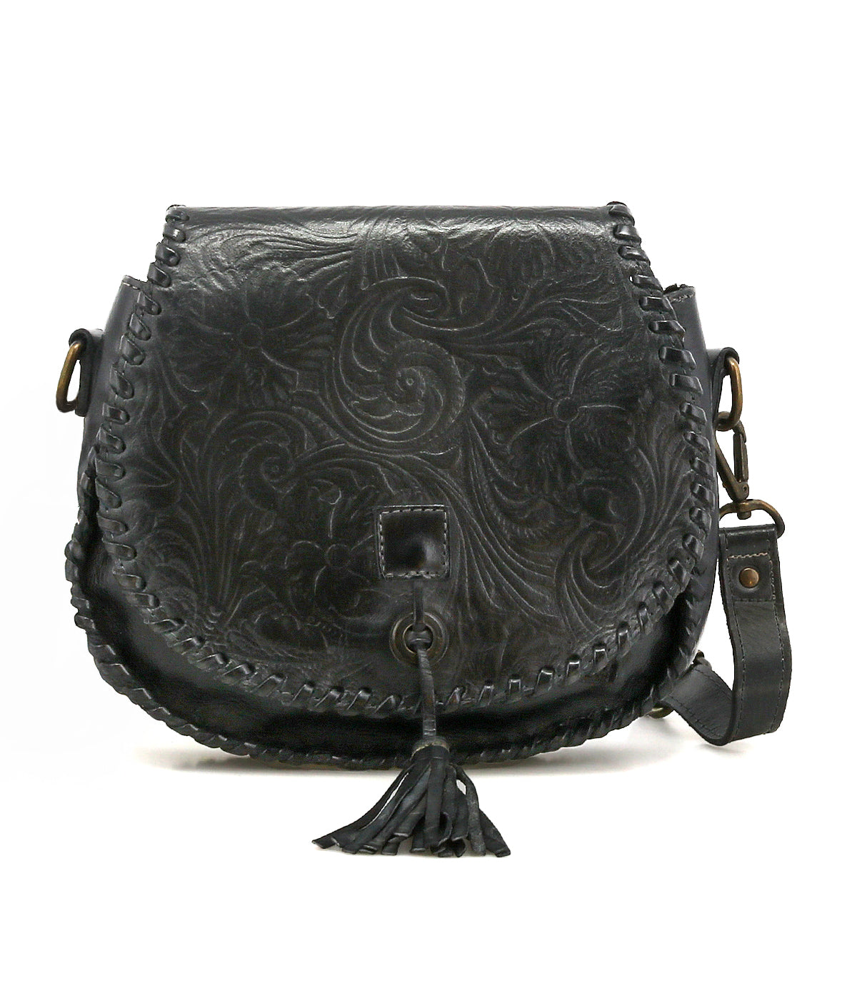 The Bed|Stü Half Moon EM is a black leather saddlebag crossbody purse with floral embossing and whipstitch edges, showcasing an embossed foliage pattern, a front tassel detail, and an adjustable strap for versatile wear.