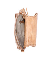 Introducing the Half Moon EM by Bed|Stü—a tan leather saddlebag crossbody purse featuring visible stitching, an open top, and a beige interior lining with a small inner pocket. This stylish bag offers versatile wear with its adjustable strap and is accented by a tassel detail on one side.
