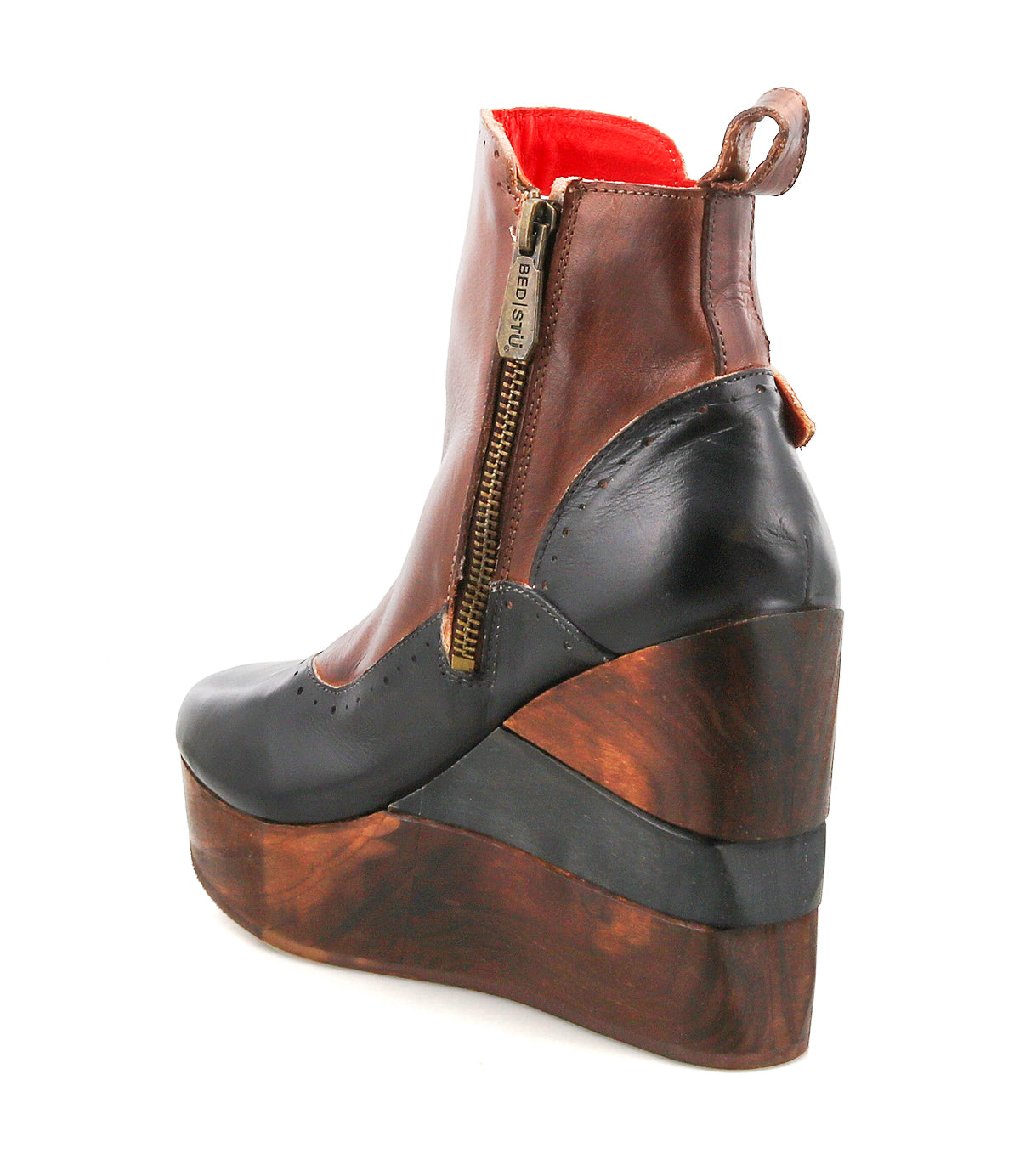 Introducing the Harmonious by Bed|Stü: a platform wedge ankle boot crafted with brown and black leather uppers, featuring a side zipper, sculpted wood base details, a platform sole, and a bold red inner lining.