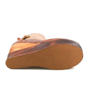A close-up view of the sole of the Bed|Stü Harmonious shoe in tan leather, highlighting its leather uppers and flat, textured brown rubber outsole as seen from the bottom.