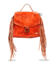 Bed|Stü's "Hidden" handbag in orange features soft leather construction, a top handle, a front flap with a metal ring closure, and long fringe accents on both sides, displayed against a white background.