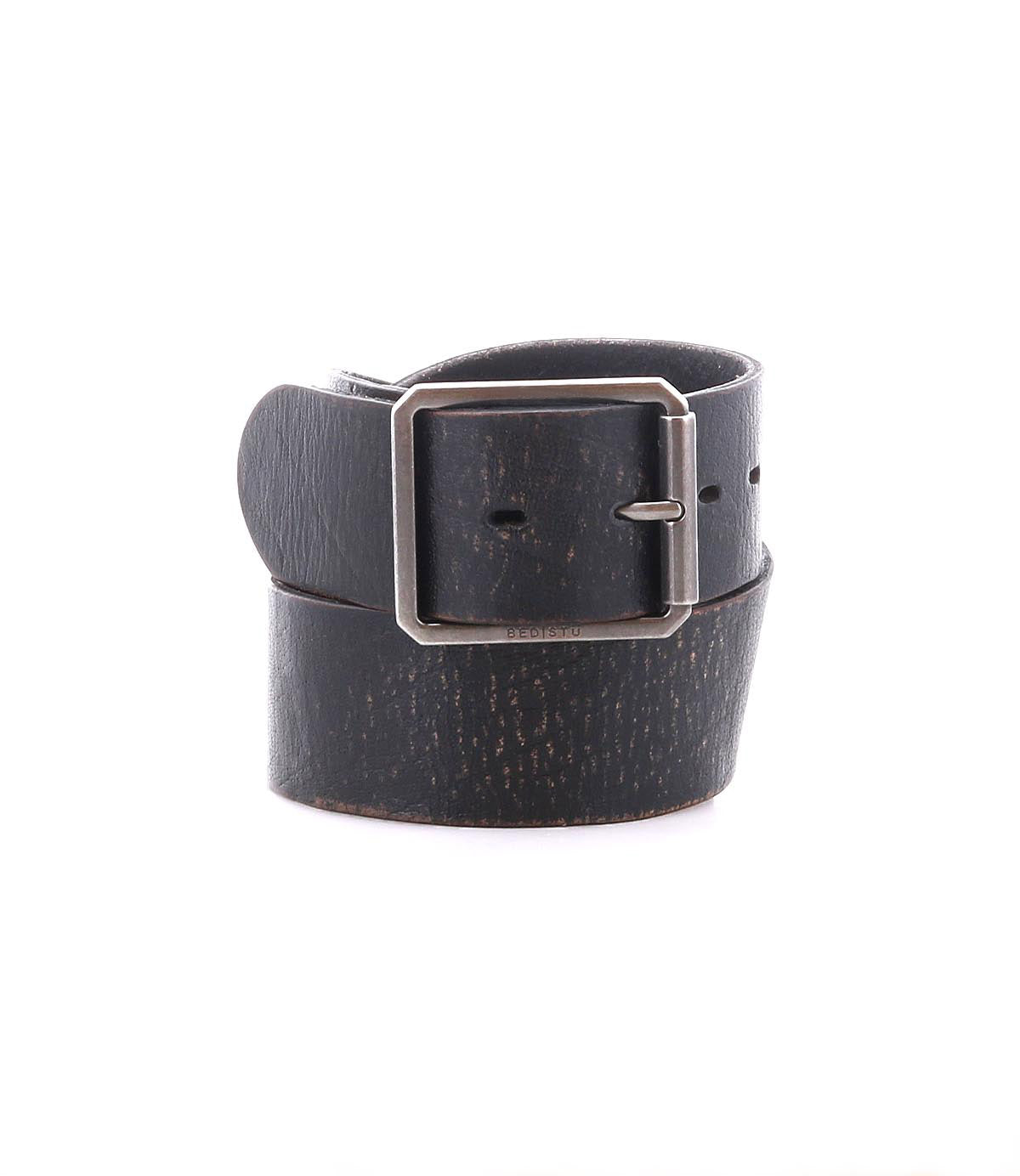 The Bed|Stü Hobo belt is featured rolled up with its square metal buckle displayed, crafted in black leather and set against a white background—an ideal accessory for everyday style.