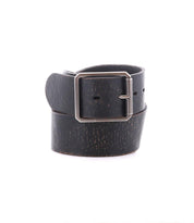 The Bed|Stü Hobo belt is featured rolled up with its square metal buckle displayed, crafted in black leather and set against a white background—an ideal accessory for everyday style.