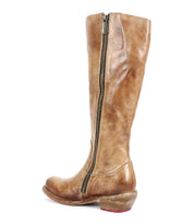 The Bed|Stü Humble boot is a brown tall leather boot featuring a square toe, zipper, and low wooden heel, displayed from the side against a white background.