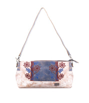 Discover the Hyperbolic by Bed|Stü—a rectangular handcrafted handbag with a long strap, showcasing a distinctly bohemian touch with red and blue floral embroidery on a blue and beige background.