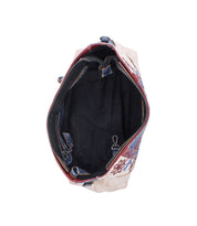Top view of the Bed|Stü Hyperbolic, an open handcrafted leather shoulder bag featuring intricate floral patterns, a black interior lining, a zipper pocket, a clasp closure, and a spacious main compartment for a distinctly bohemian touch.