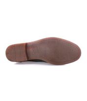 The image displays the brown sole of the Bed|Stü Illiad modern lace-up dress shoe, photographed from the bottom against a white background.