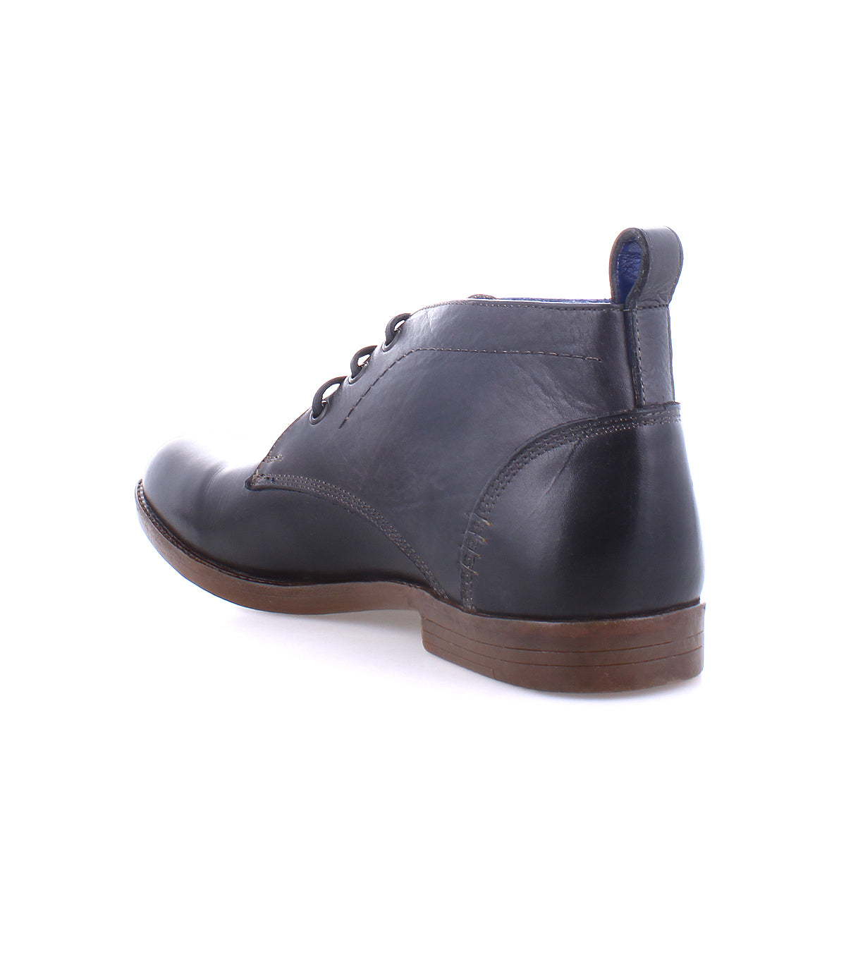 The Bed|Stü Illiad is a single black leather chukka ankle boot, featuring a modern lace-up design and a comfortable outsole, displayed from the back and side against a white background.