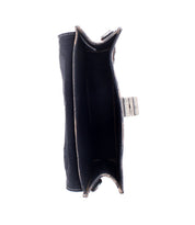 Top view of the Bed|Stü Improv—an empty, open black wallet with a snap closure, featuring two main compartments and visible edge stitching. This compact design is ideal for pairing with any mini purse or crossbody strap.