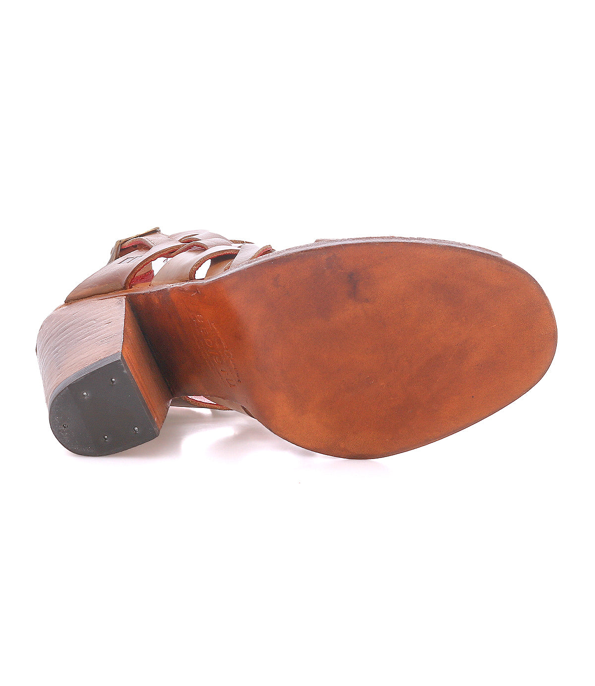 Bottom view of the Bed|Stü Intersection brown leather heeled sandal with a wooden sole and stacked heel, featuring crossover straps and an adjustable ankle strap, showing signs of light wear.
