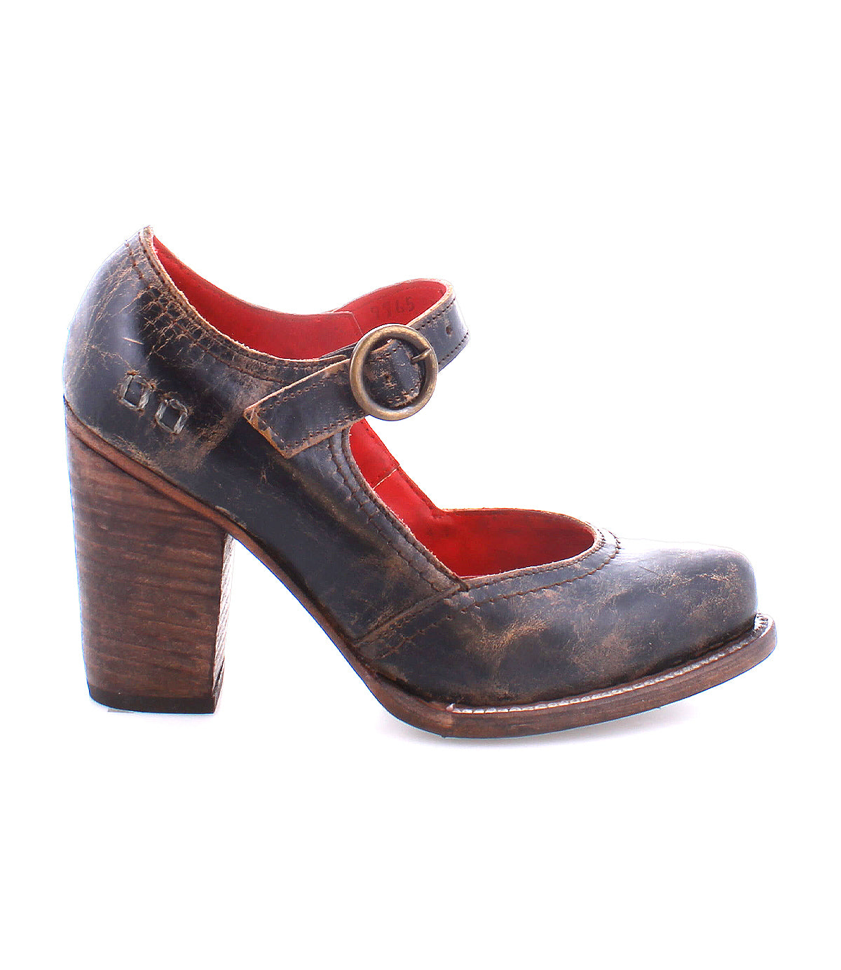Introducing the Ishtar by Bed|Stü—a vintage-inspired women’s Mary Jane pump, crafted with a distressed brown leather upper, accented by a bold chunky wooden block heel, red inner lining, and an adjustable buckle strap.